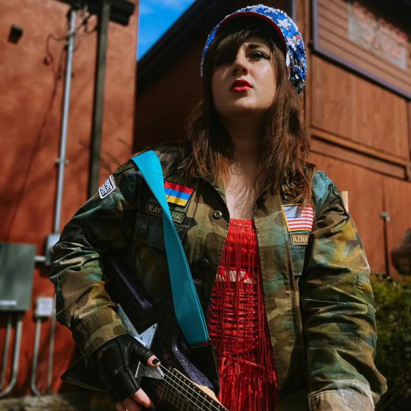 Kay Azna & The Weapons of Mass Elation Brand Page