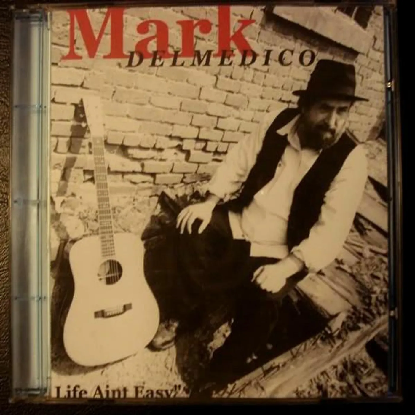Mark DelMedico Brand Page
