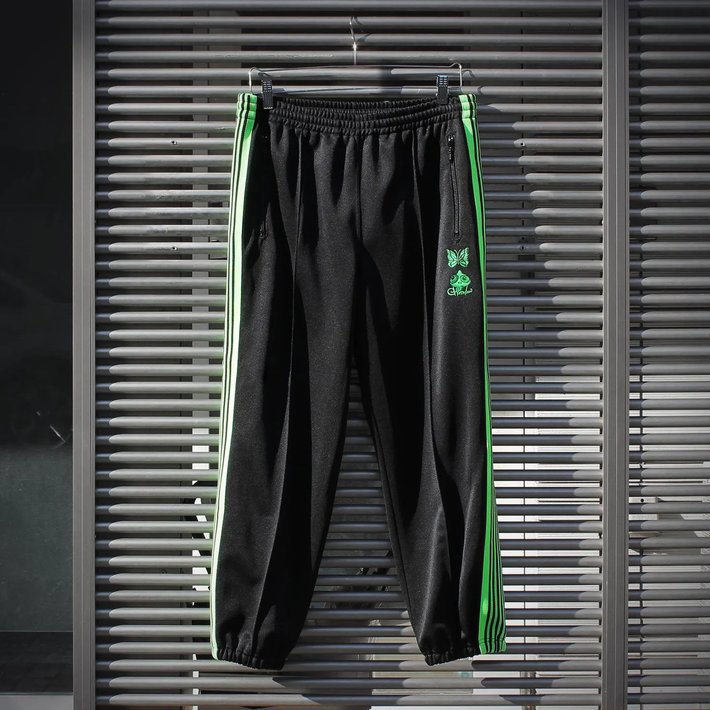 End of the World 【EOTW x NEEDLES】ZIPPED TRACK PANT POLY SMOOTH / Chameleon Emb.