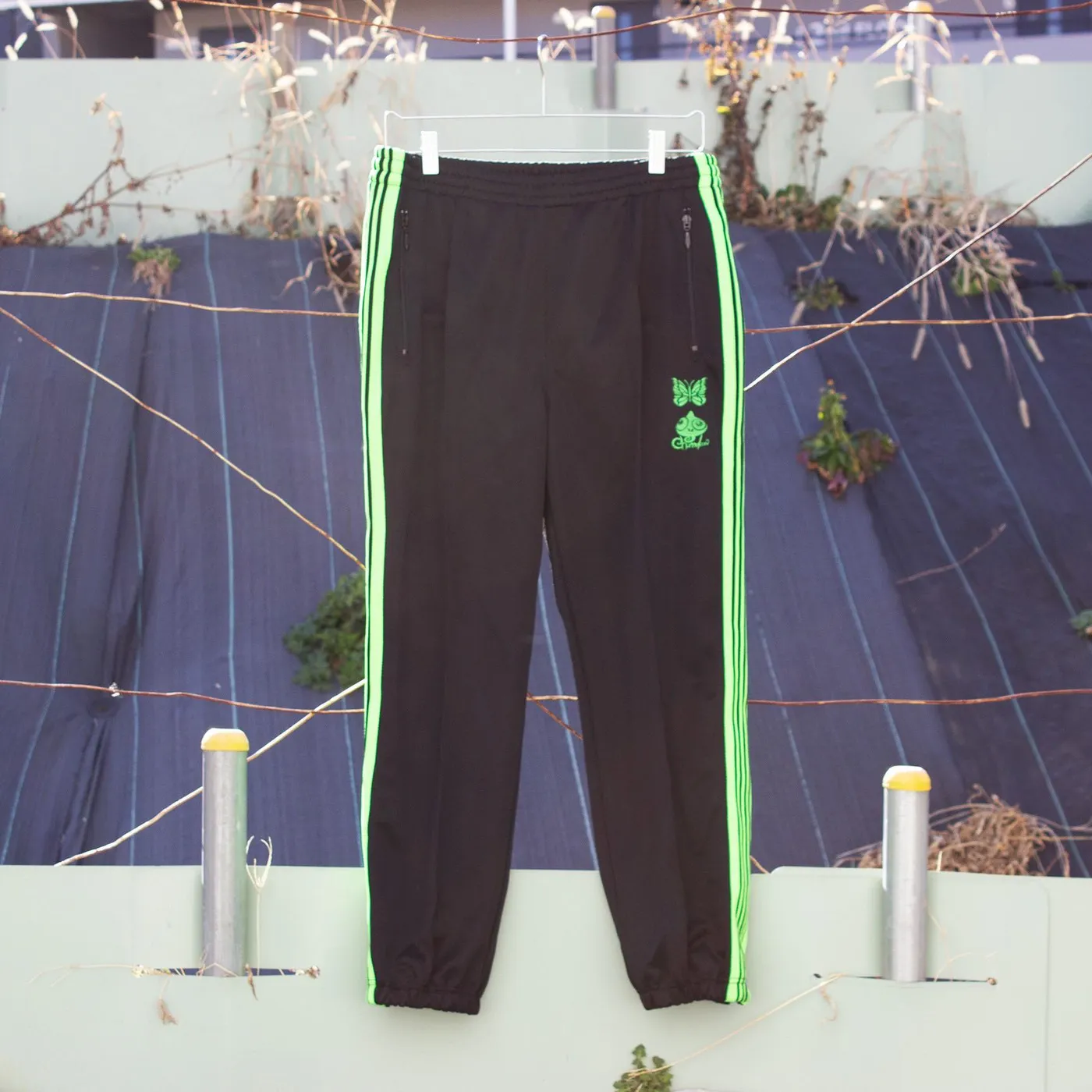End of the World 【EOTW x NEEDLES】ZIPPED TRACK PANT POLY SMOOTH / Chameleon Emb.